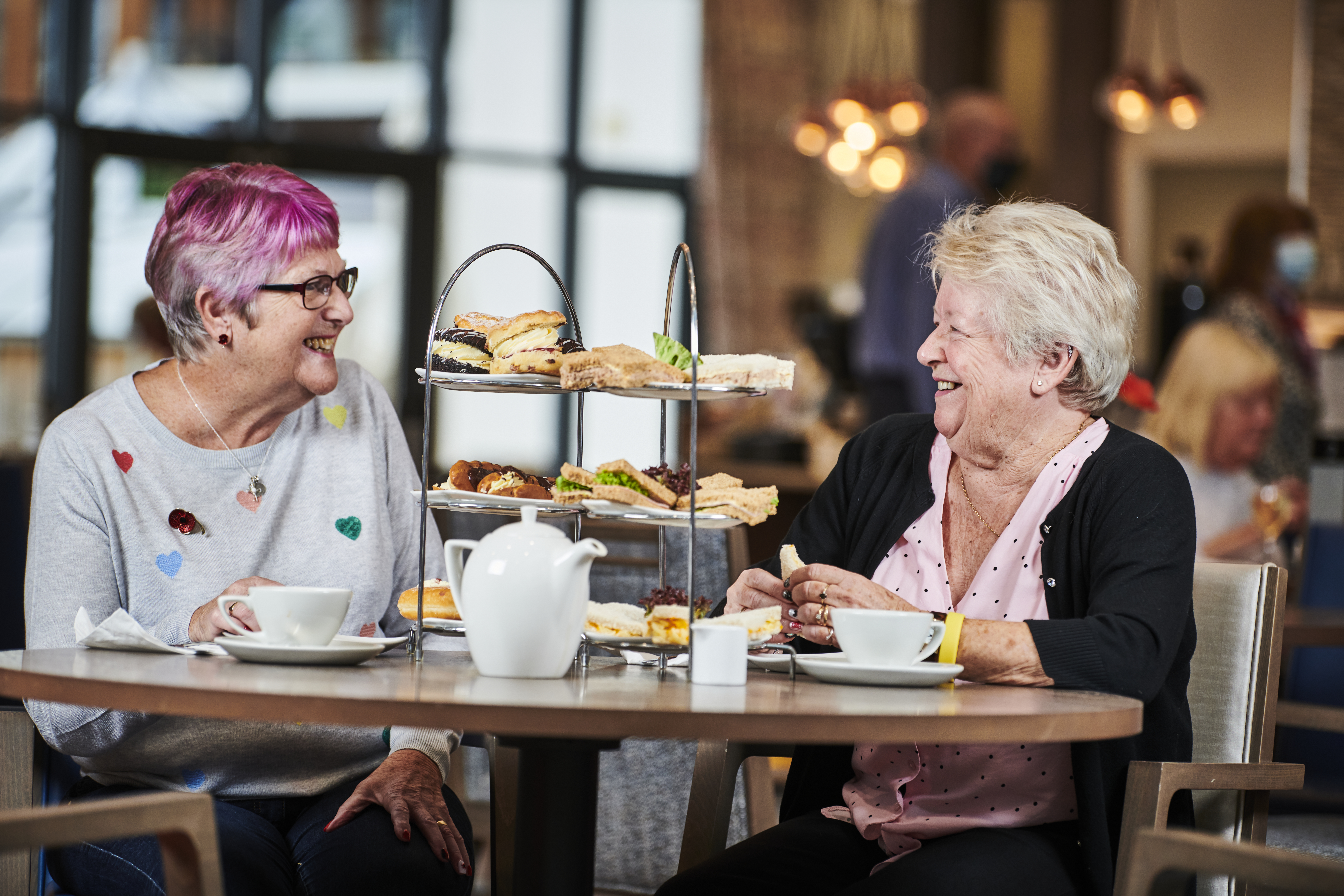 Two female residents having afternoon tea at Stoke Gifford Village