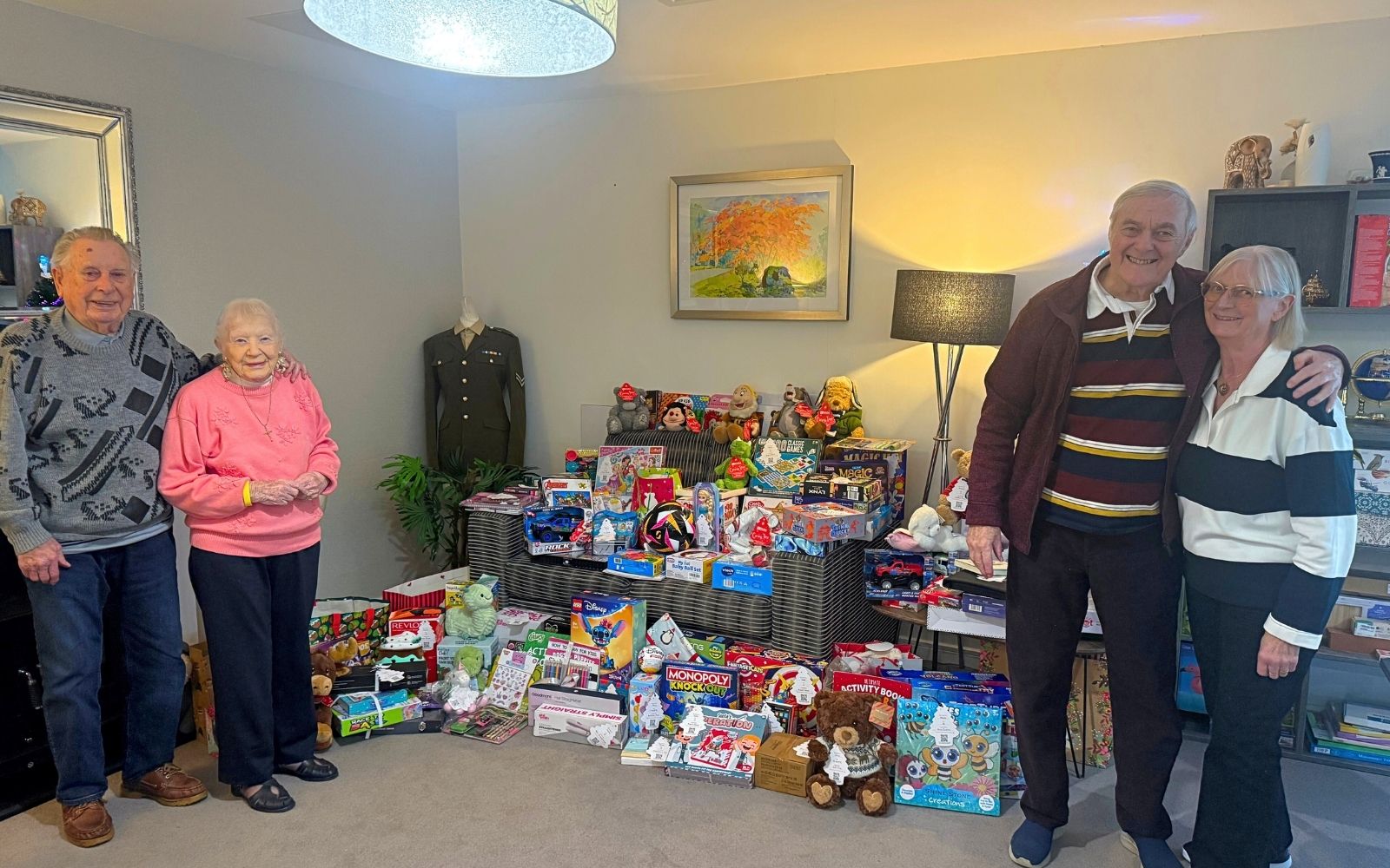 4 Residents stood in front of presents.