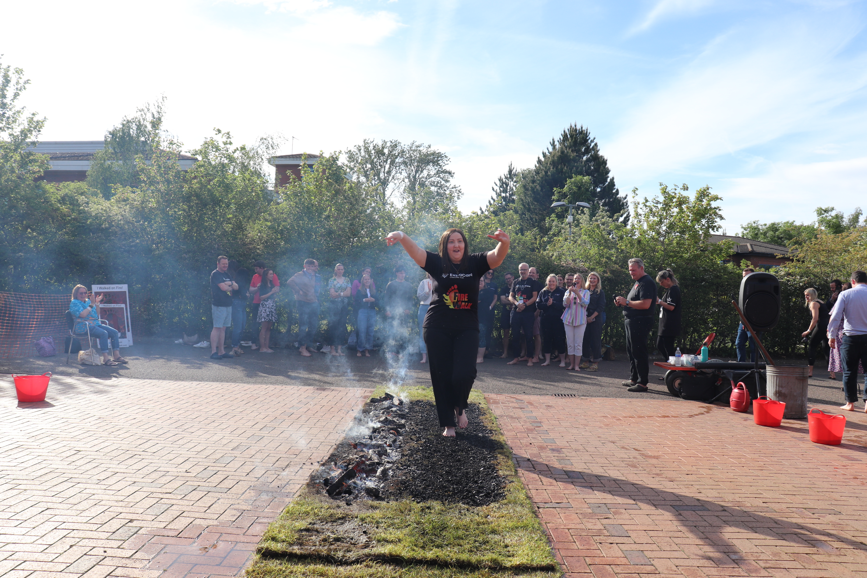 Local supporters brave the coals for charity fire walk